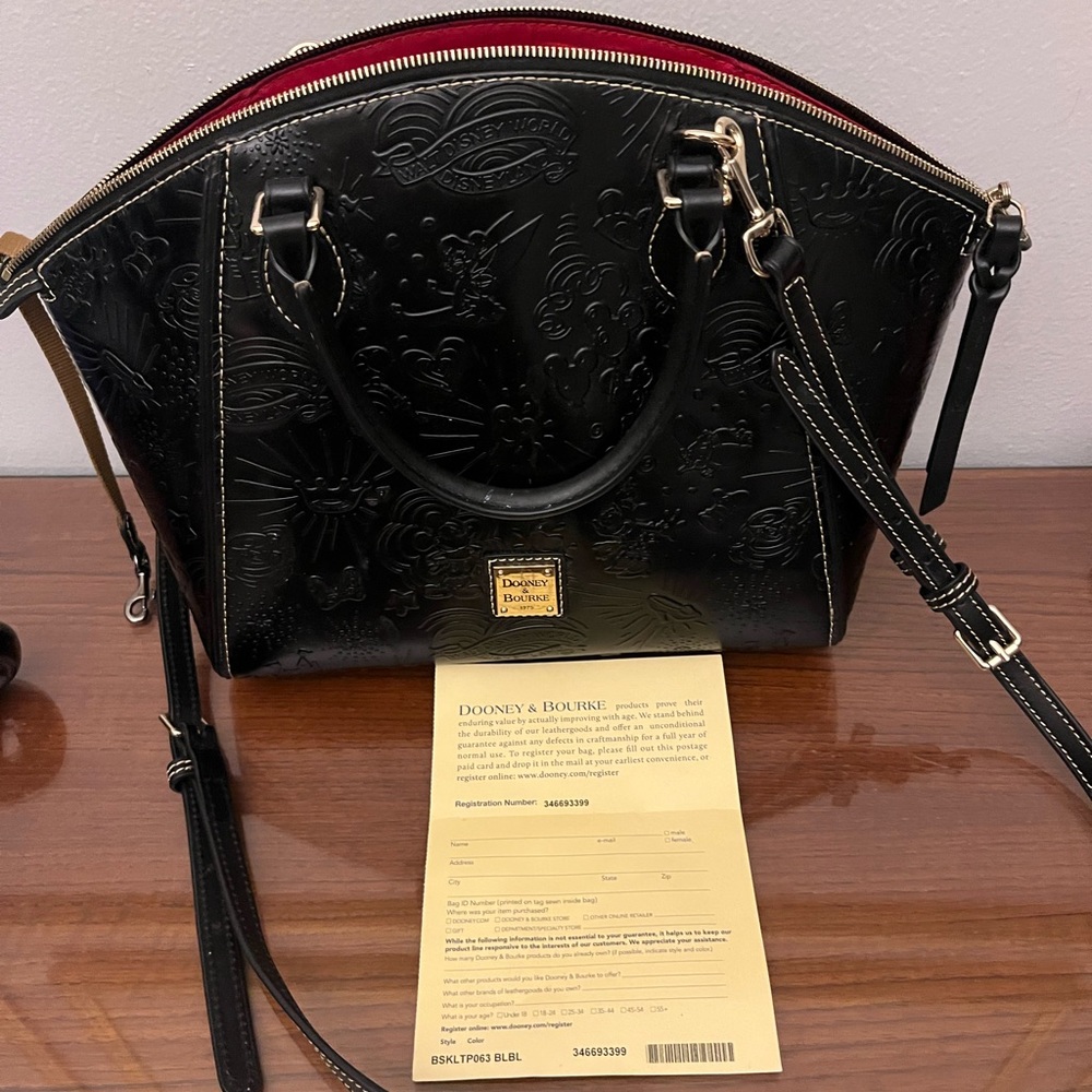 Black embossed Disney Dooney Satchel.